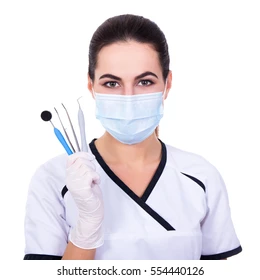 dentist woman in mask with tools isolated on white background